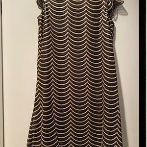 Vintage party dress black and gold sequences in scalloped design on net.